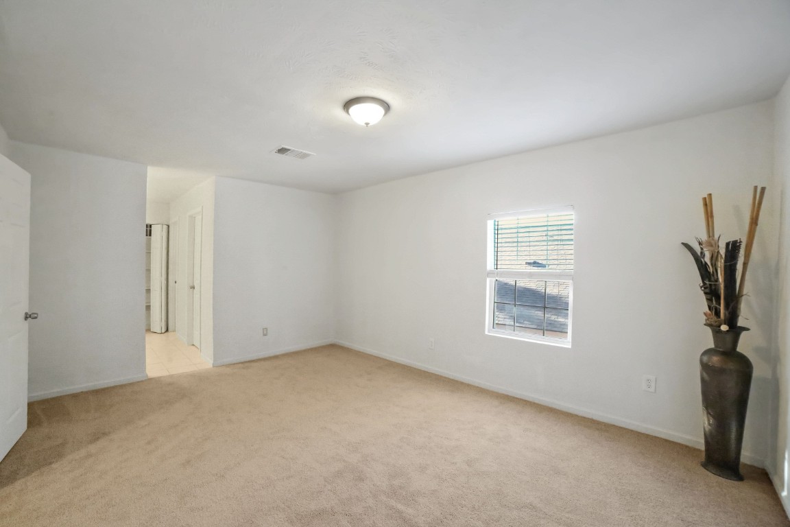 12323 Split Rail Lane Houston, TX 77071 - Photo 23 of 29 a view of an empty room with a window