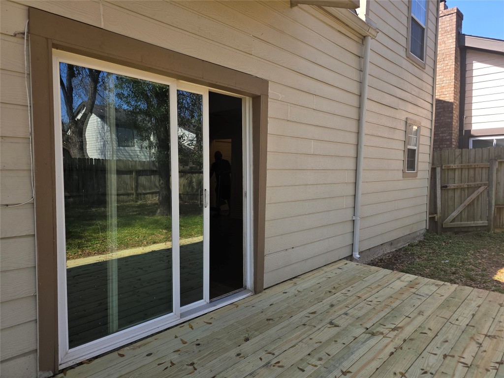 12323 Split Rail Lane Houston, TX 77071 - Photo 26 of 29 a view of a porch with a door and wooden floor