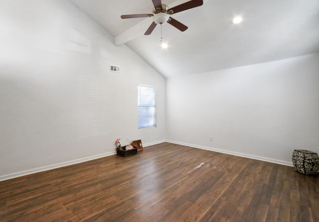 12323 Split Rail Lane Houston, TX 77071 - Photo 5 of 29 a view of a room with wooden floor and a ceiling fan