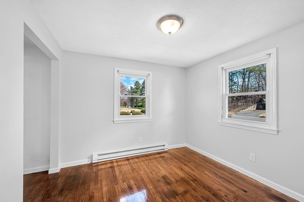 381 North Brook Road Springfield, MA 01119 - Photo 15 of 35 a view of an empty room with window and wooden floor