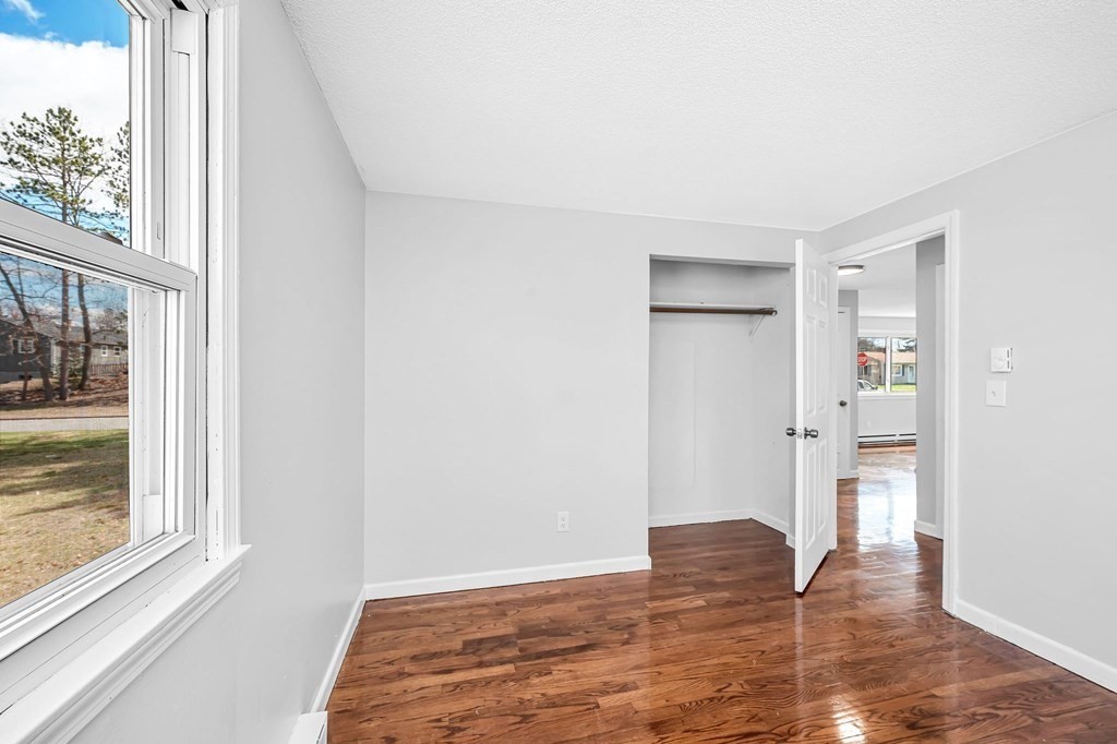 381 North Brook Road Springfield, MA 01119 - Photo 20 of 35 a view of empty room with wooden floor and fan