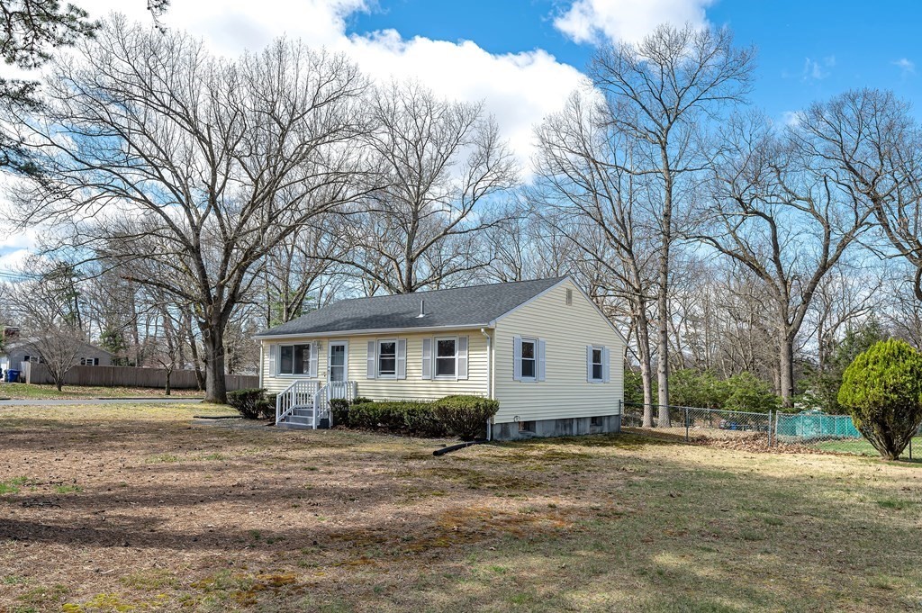 381 North Brook Road Springfield, MA 01119 - Photo 28 of 35 a front view of a house with a yard and trees