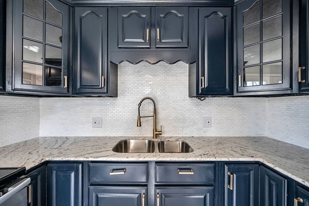 381 North Brook Road Springfield, MA 01119 - Photo 4 of 35 a kitchen with stainless steel appliances granite countertop a sink and dishwasher cabinets with wooden floor