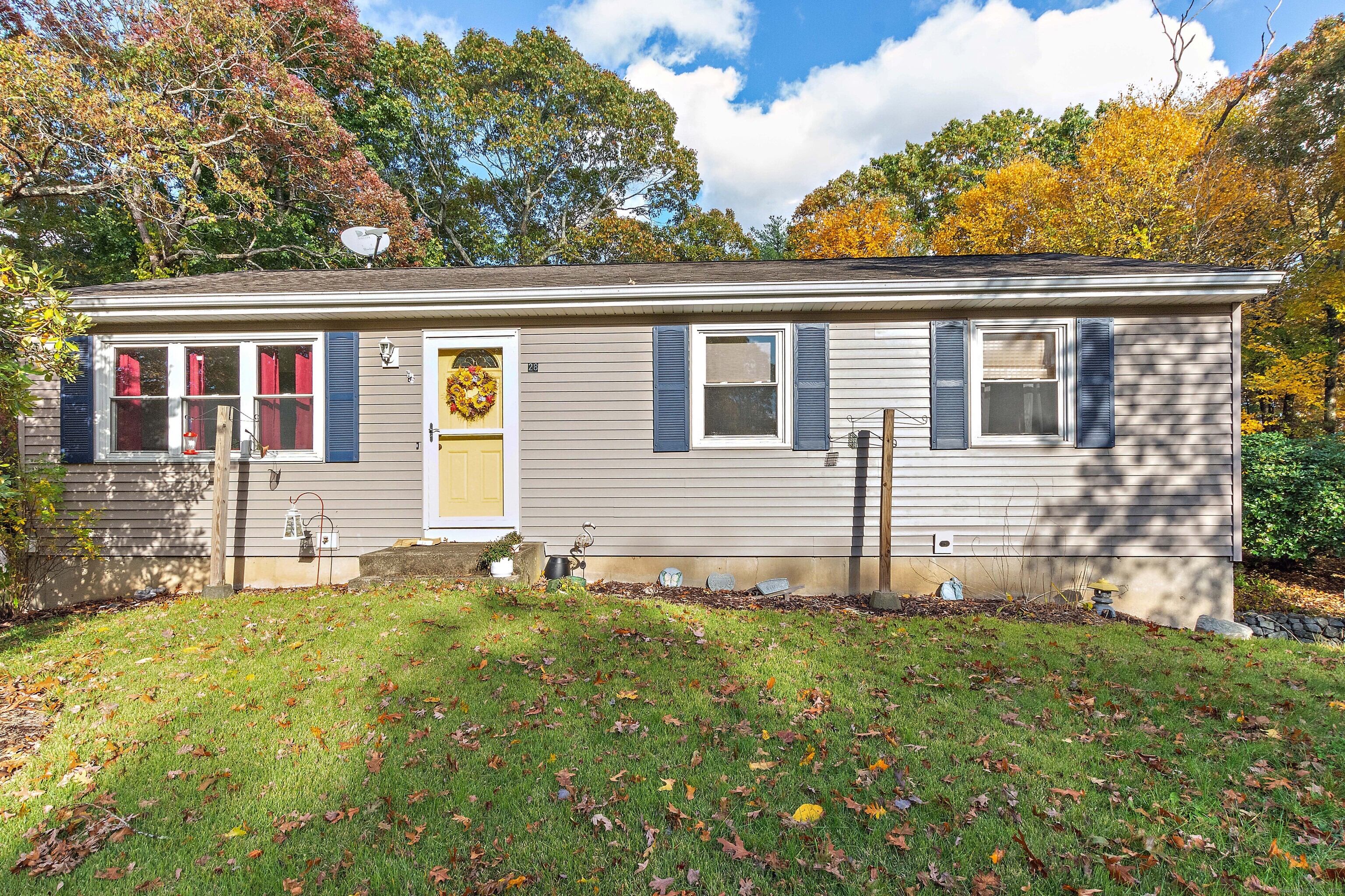 28 Juniper Lane Griswold, CT 06351 - Photo 2 of 15 a front view of a house with garden
