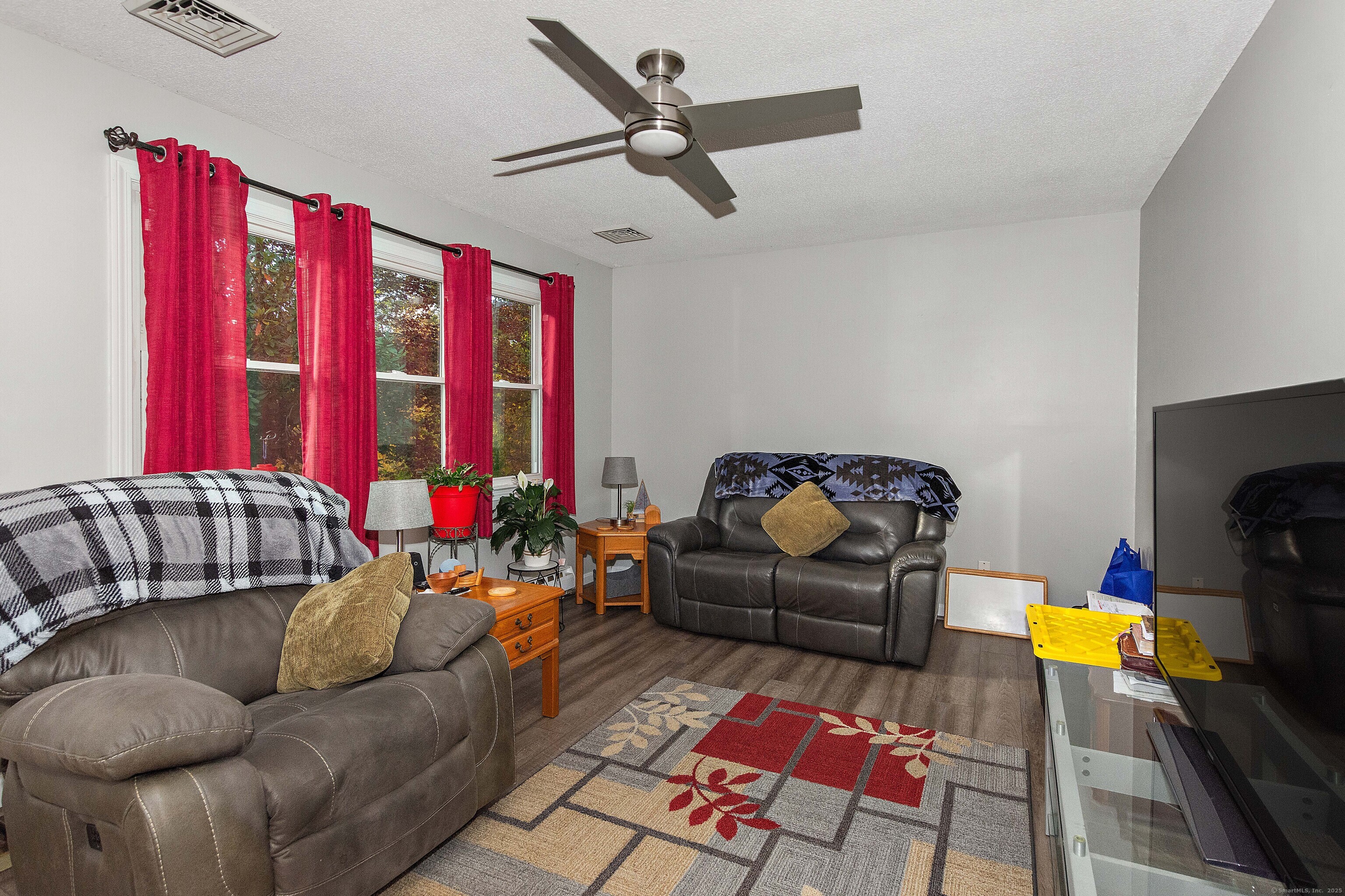 28 Juniper Lane Griswold, CT 06351 - Photo 6 of 15 a living room with furniture and a flat screen tv