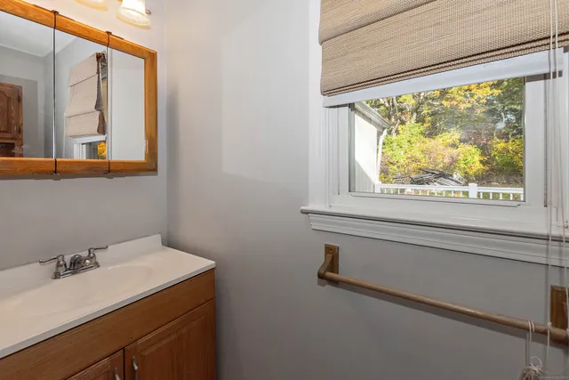 a bathroom with a sink and a window