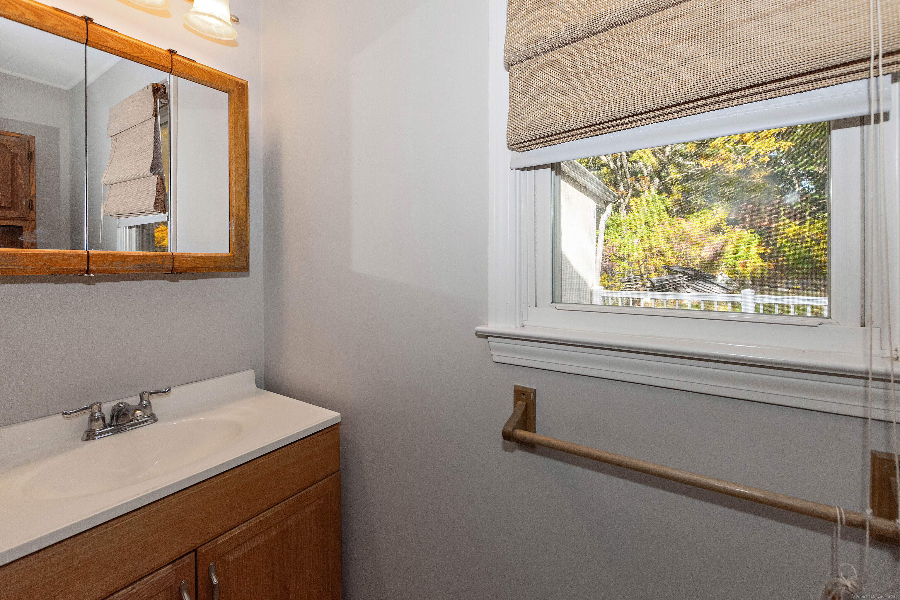 28 Juniper Lane Griswold, CT 06351 - Photo 10 of 15 a bathroom with a sink and a window