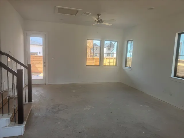 a room with windows and cabinet