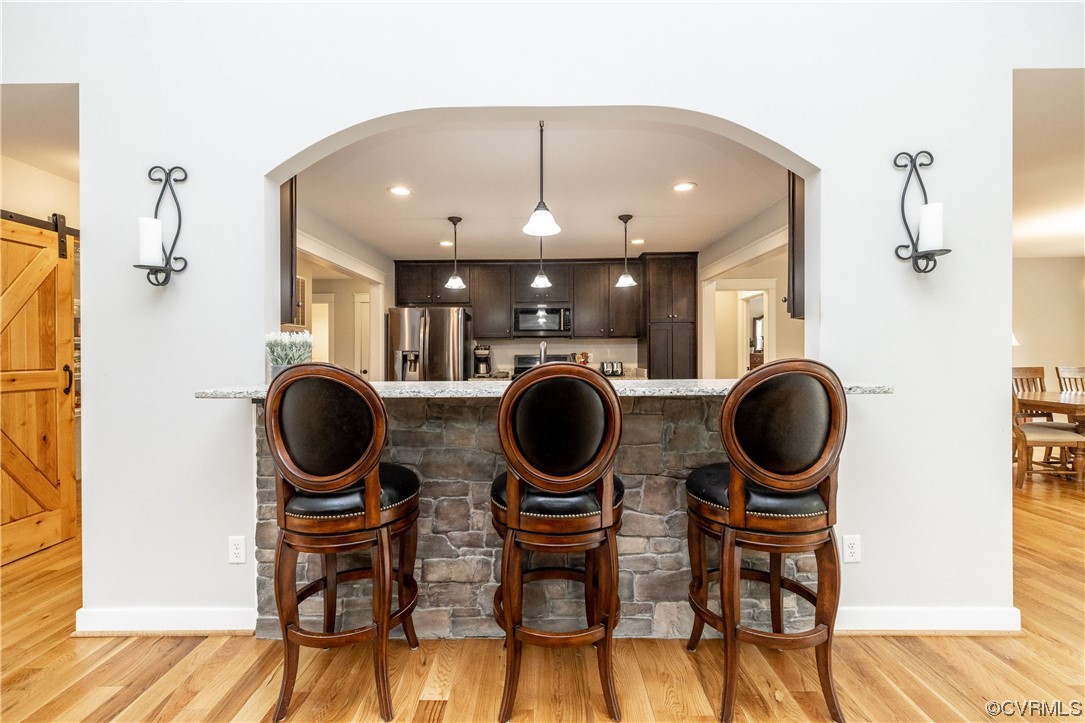 5497 Old Columbia Road Goochland, VA 23063 - Photo 12 of 41 a view of a dining room with furniture and a fan