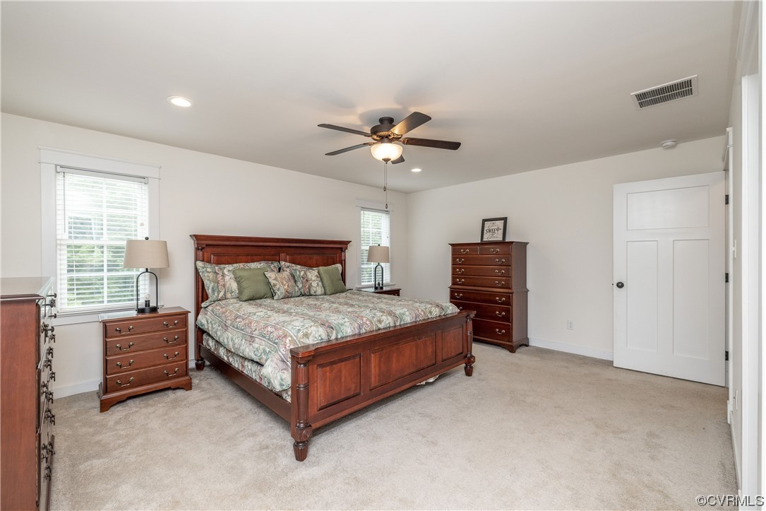 5497 Old Columbia Road Goochland, VA 23063 - Photo 25 of 41 a bedroom with a bed and a chandelier