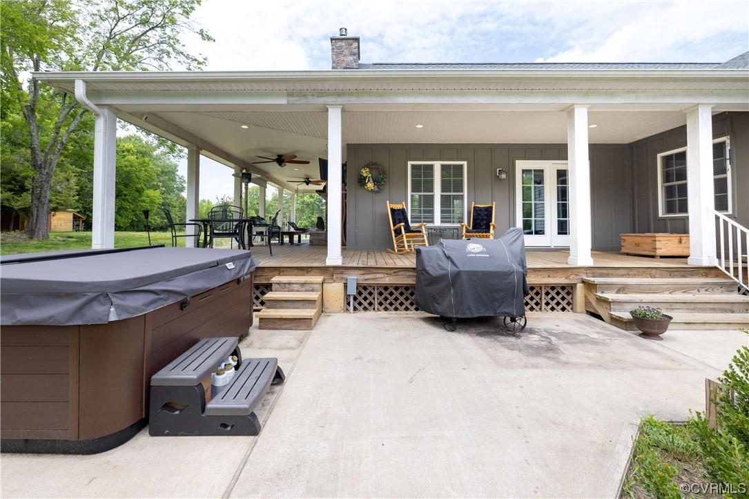 5497 Old Columbia Road Goochland, VA 23063 - Photo 32 of 41 a view of a patio with table and chairs potted plants with floor to ceiling window