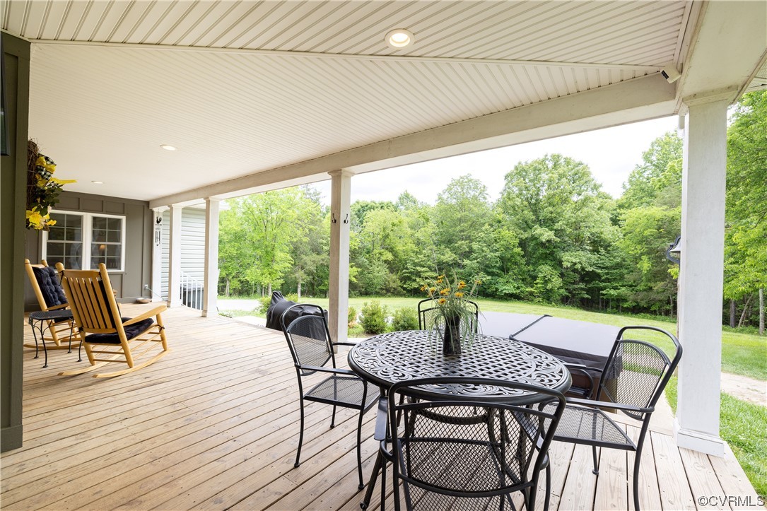 5497 Old Columbia Road Goochland, VA 23063 - Photo 6 of 41 a view of a patio with a table chairs and a patio