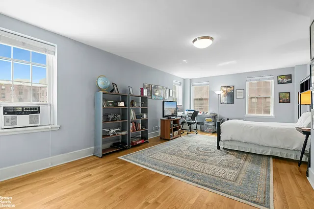 a living room with furniture rug and window