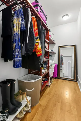 a bathroom with a sink vanity and tub