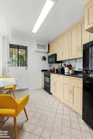 a view of a patio with couple of chairs