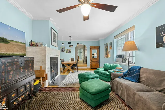a living room with furniture and a fireplace