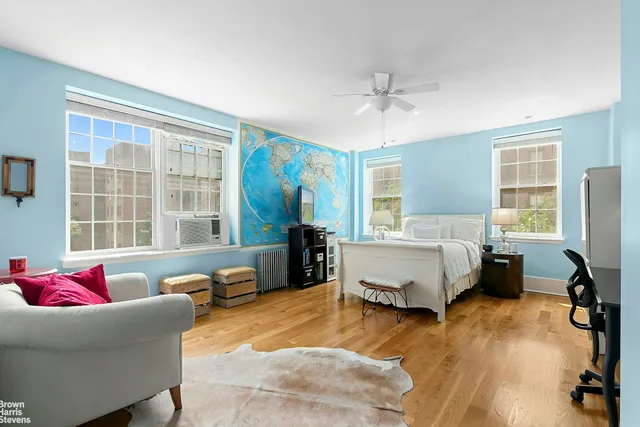 a view of balcony with chairs and wooden fence