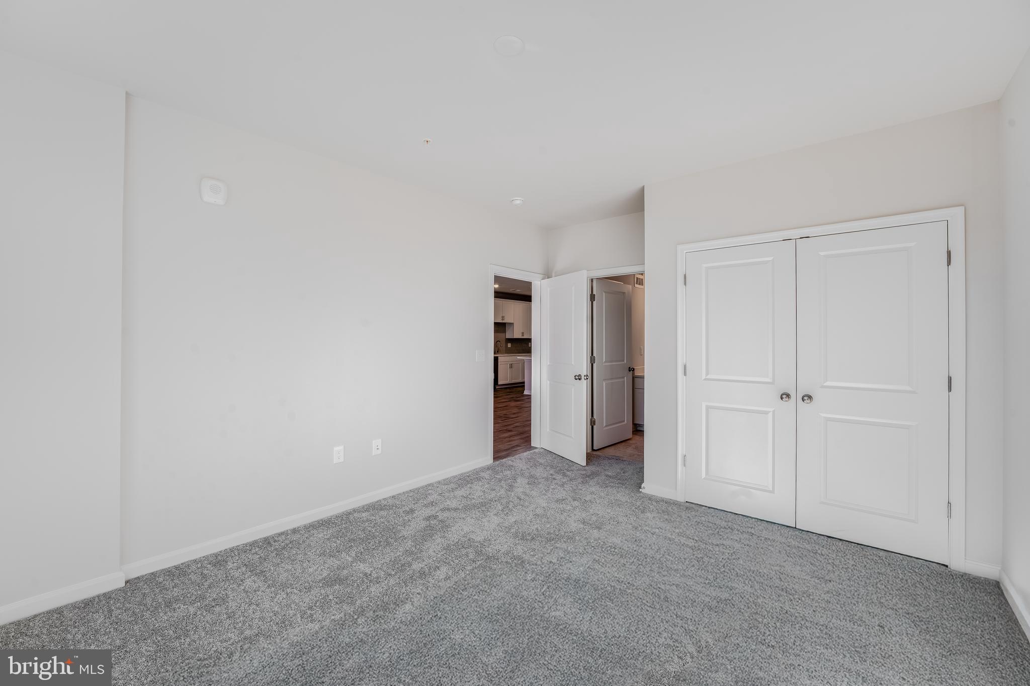4003 Seaside Alder Road, Unit 409 LILAC Bowie, MD 20720 - Photo 12 of 24 a view of an empty room and closet area