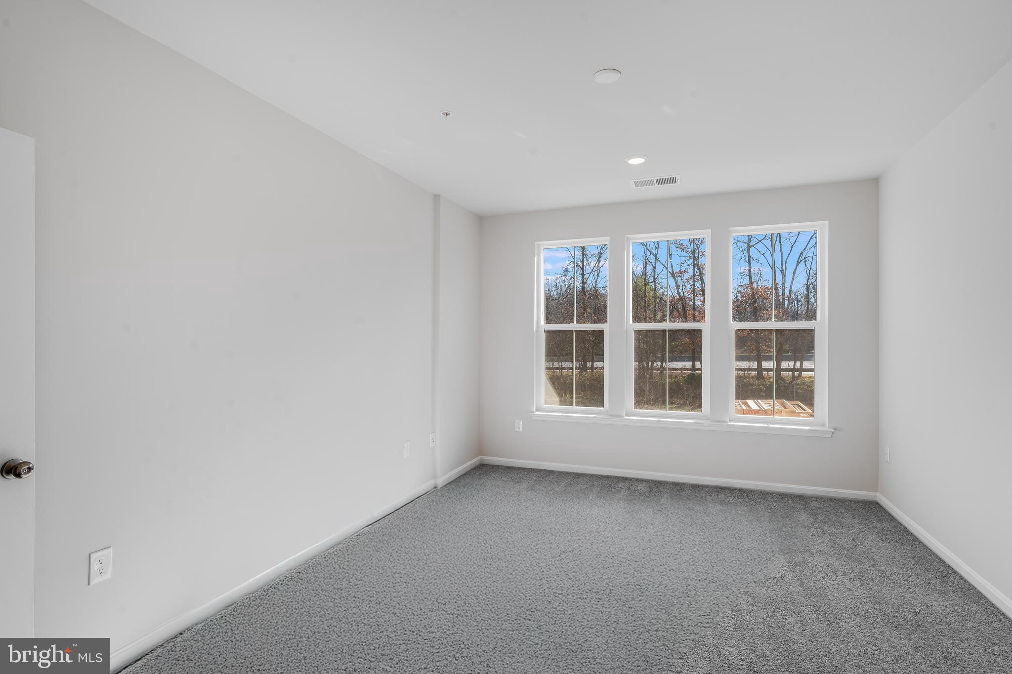 4003 Seaside Alder Road, Unit 409 LILAC Bowie, MD 20720 - Photo 14 of 24 an empty room with a window