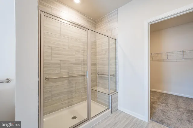 a bathroom with a shower and a sink