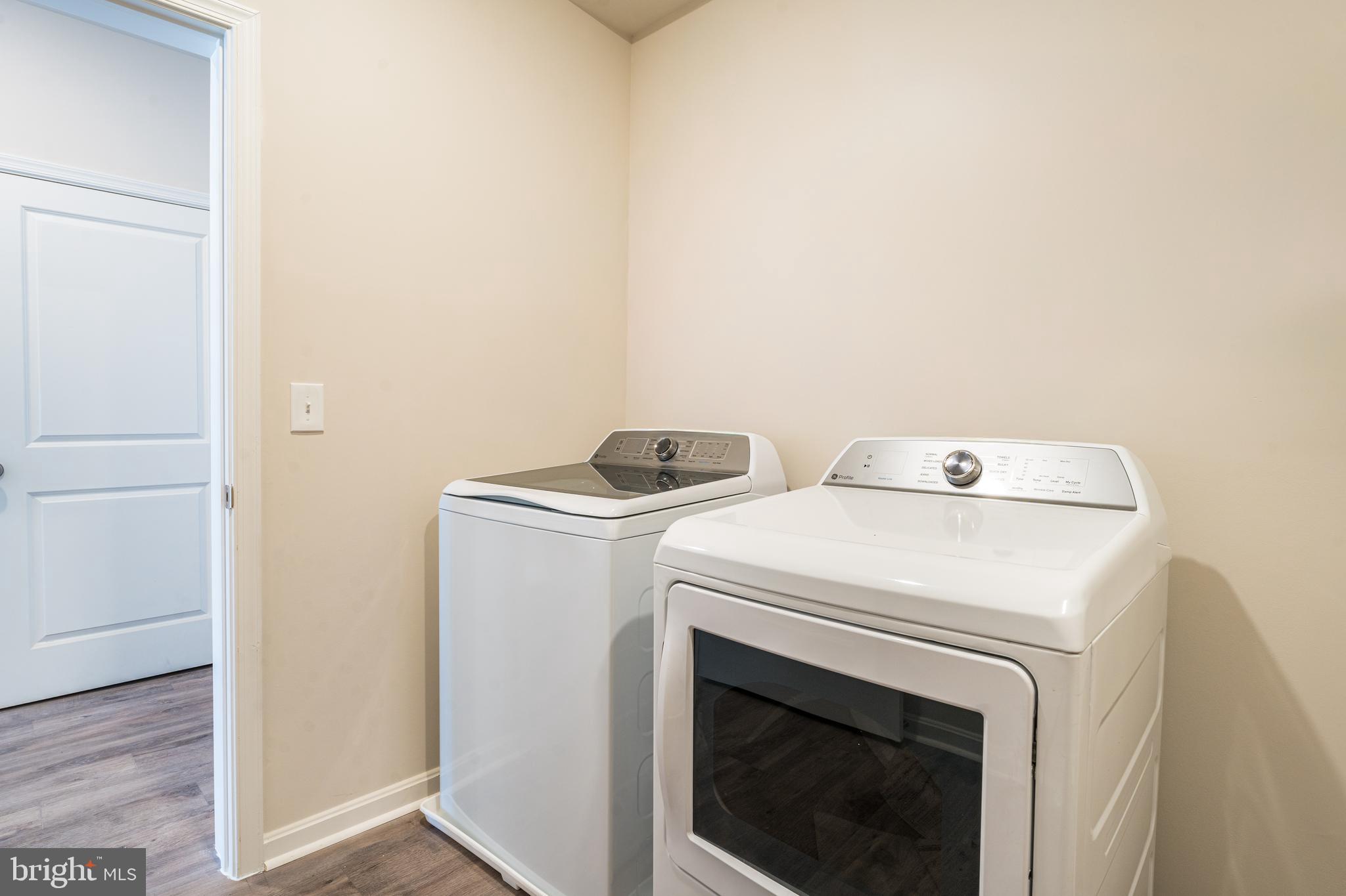 4003 Seaside Alder Road, Unit 409 LILAC Bowie, MD 20720 - Photo 24 of 24 a utility room with dryer and washer