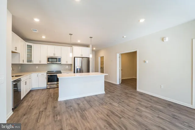 a view of kitchen with wooden floor