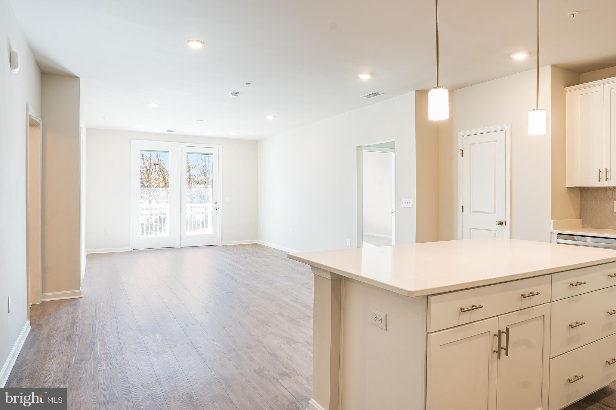 4003 Seaside Alder Road, Unit 409 LILAC Bowie, MD 20720 - Photo 7 of 24 a view of a kitchen with wooden floor