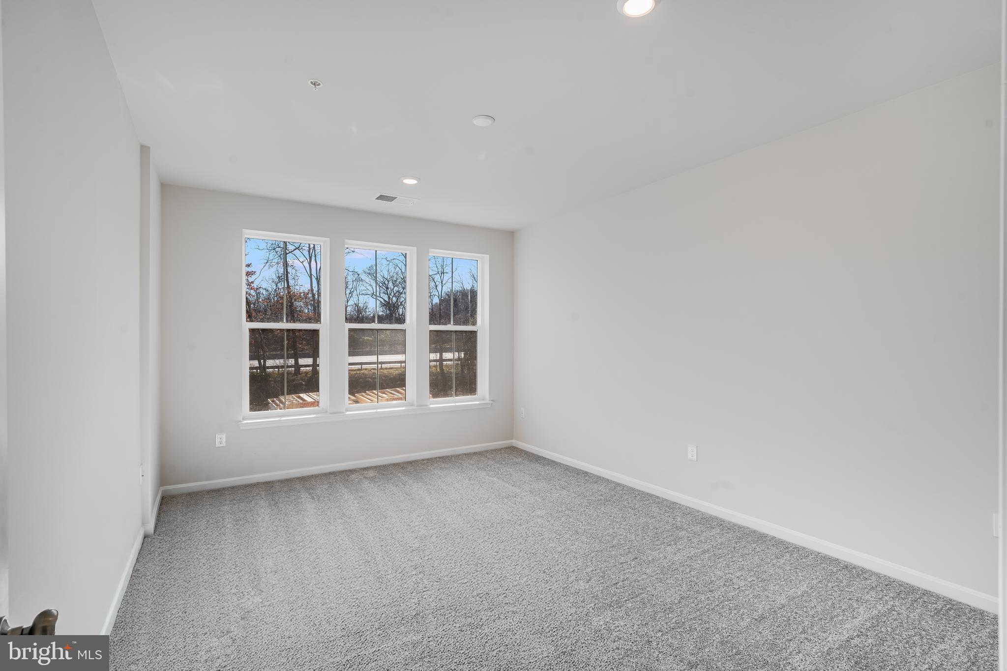 4003 Seaside Alder Road, Unit 409 LILAC Bowie, MD 20720 - Photo 10 of 24 an empty room with a window