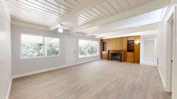 a kitchen with a sink stove top oven and cabinets