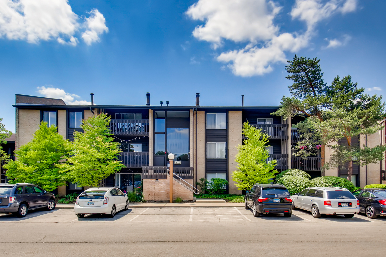 6177 Knoll Wood Road, Unit 201 Willowbrook, IL 60527 - Photo 1 of 11 a car parked in front of a building