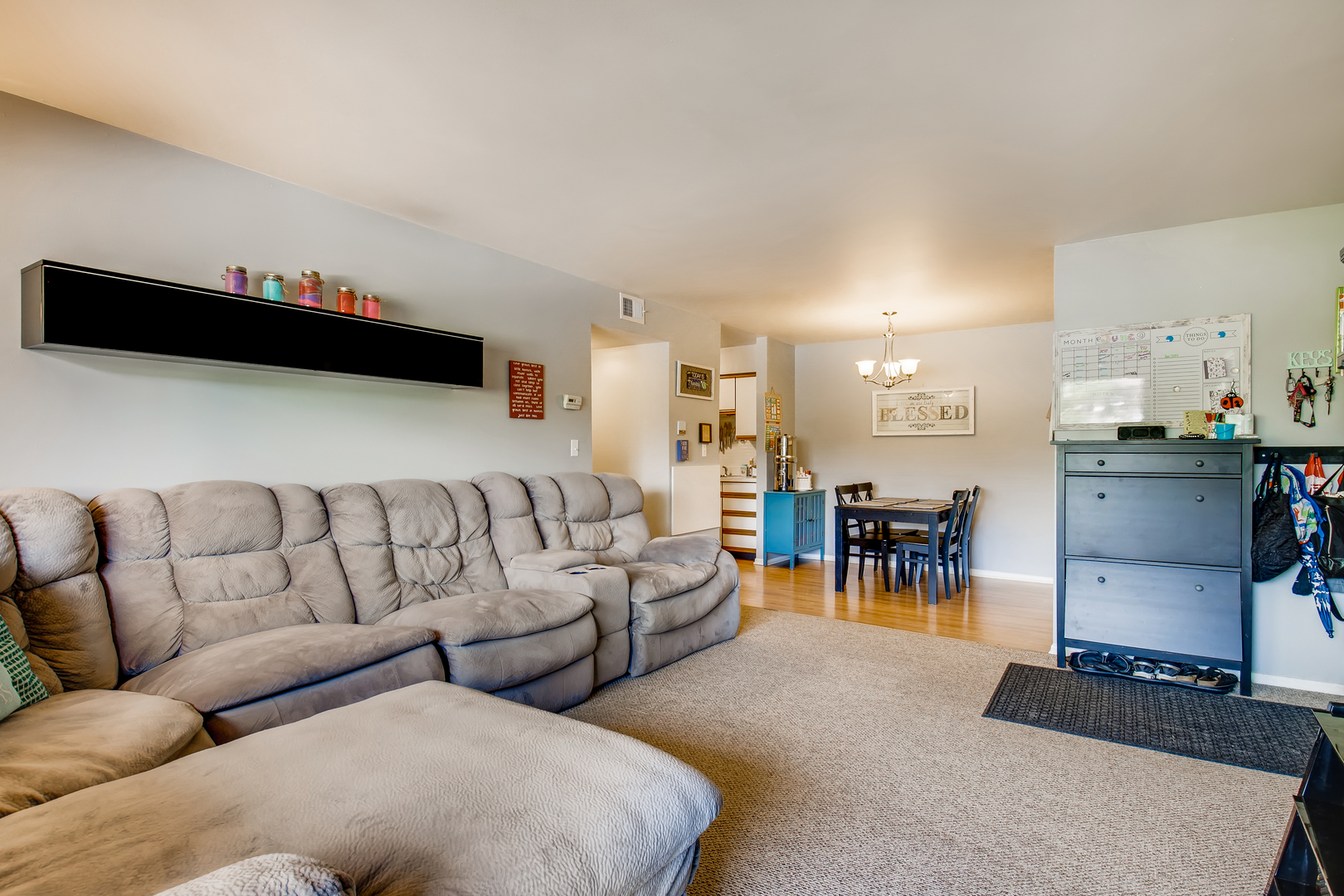 6177 Knoll Wood Road, Unit 201 Willowbrook, IL 60527 - Photo 4 of 11 a living room with furniture and a lamp