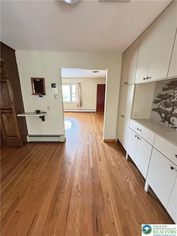 a view of a kitchen with wooden floor