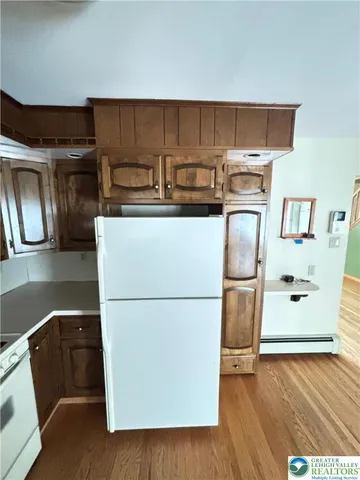 a kitchen with appliances and cabinets
