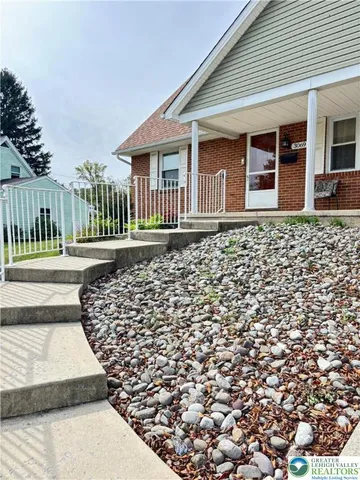 a front view of a house with a fence