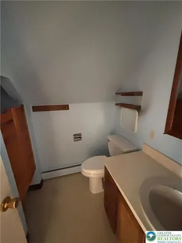 a bathroom with a sink and toilet