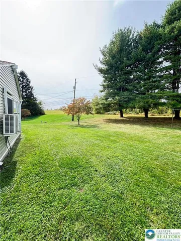 a view of a water fountain and a big yard