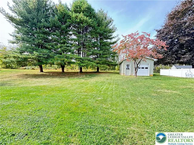 a house view with swimming pool in front of it