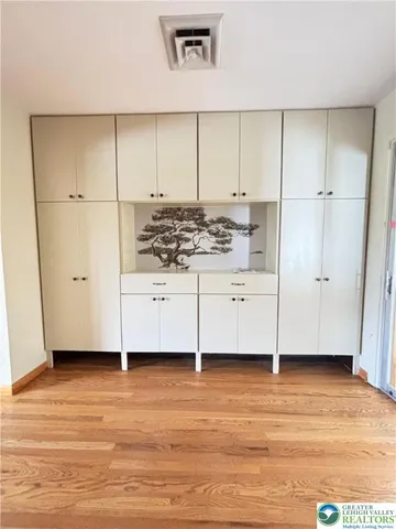 a kitchen with granite countertop a sink and a stove