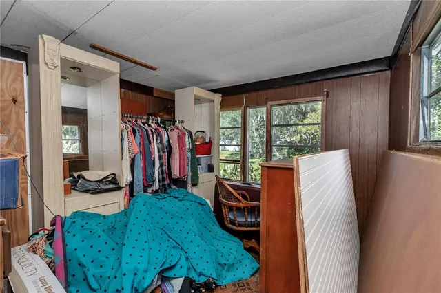 a bed room with a bed and a window