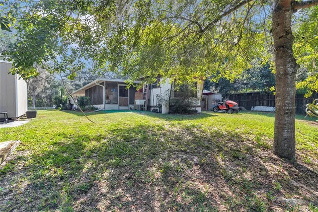 a view of a house with a yard porch and sitting area