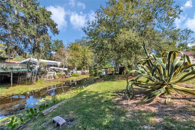 a view of yard with swimming pool