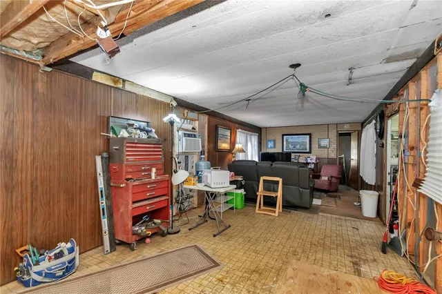 a room with lots of furniture and clutter