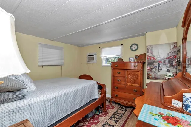 a bedroom with a bed and furniture