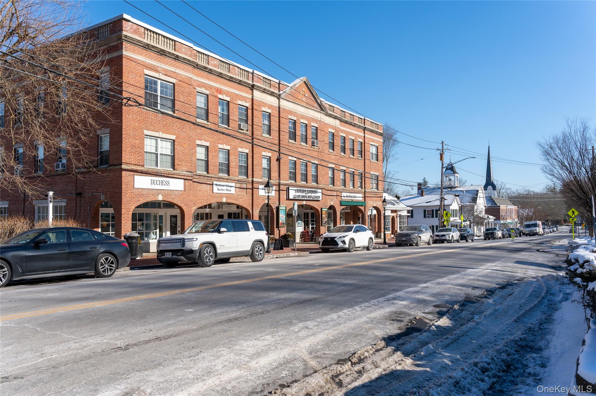 633 Old Post Road, Unit 34 Bedford, NY 10506 - Photo 14 of 14 a view of a building and a street
