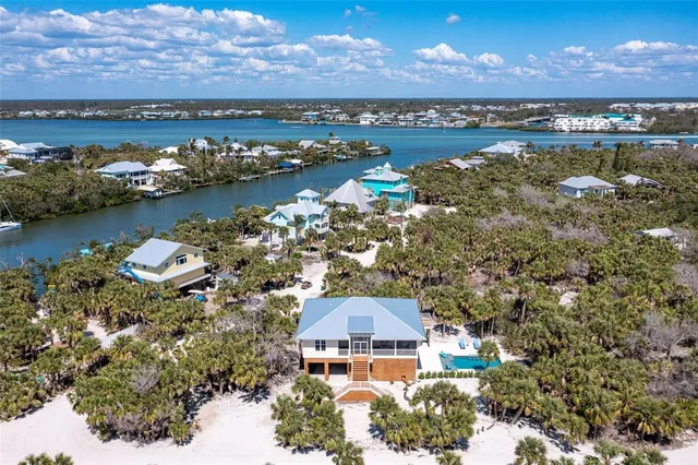 aerial view of a house with a lake view