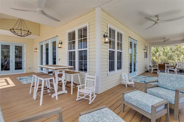 a view of a livingroom with furniture window and wooden floor