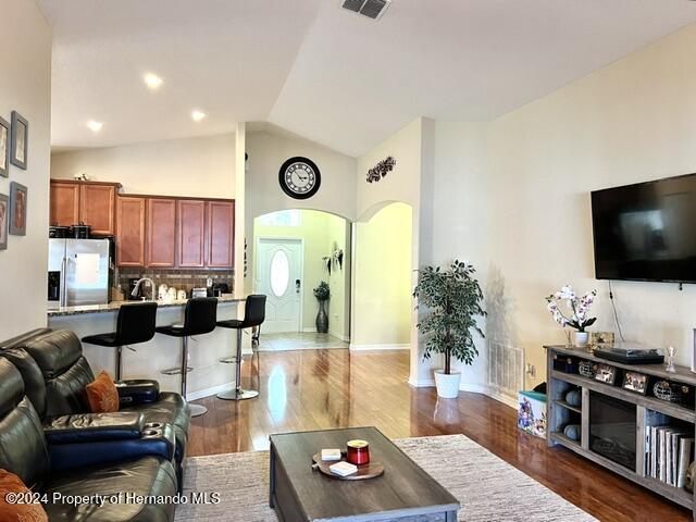 18430 Waydale Loop Hudson, FL 34667 - Photo 13 of 30 a living room with furniture and a flat screen tv