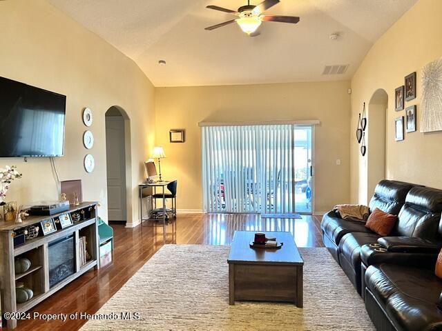 18430 Waydale Loop Hudson, FL 34667 - Photo 16 of 30 a living room with furniture and a flat screen tv