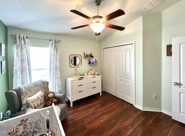 18430 Waydale Loop Hudson, FL 34667 - Photo 24 of 30 a bed room with furniture and windows