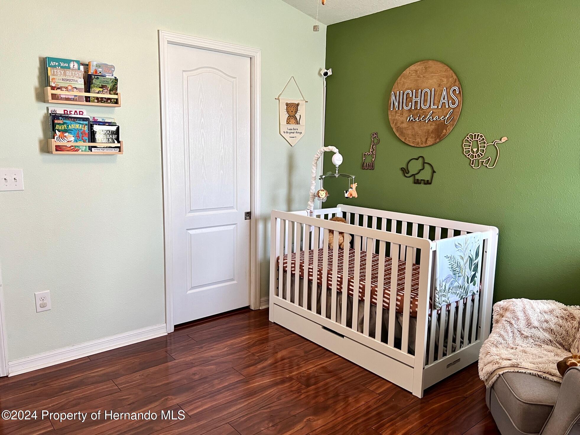 18430 Waydale Loop Hudson, FL 34667 - Photo 28 of 30 a view of a hallway with wooden floor